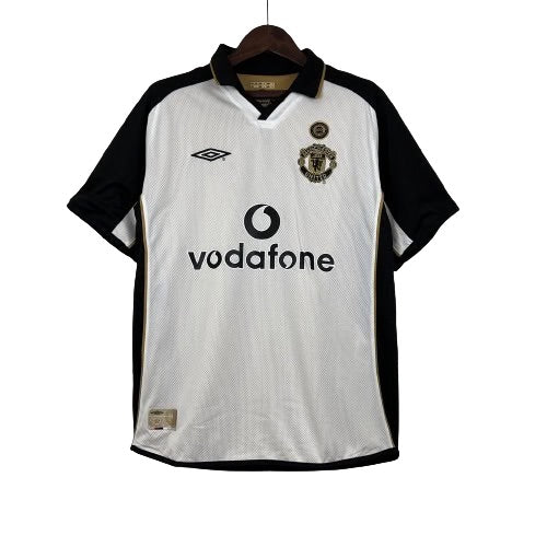 Camisa Dupla Face Retrô Manchester United Umbro 2001/02 100 Anos Masculina Branca e Preta ou Dourada